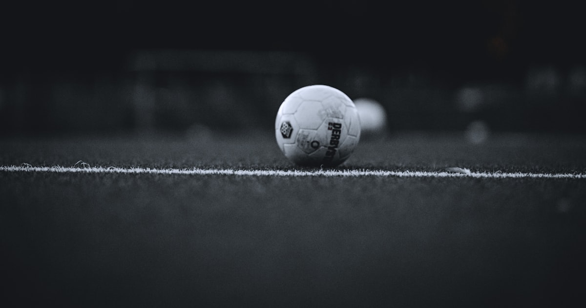 white soccer ball on field