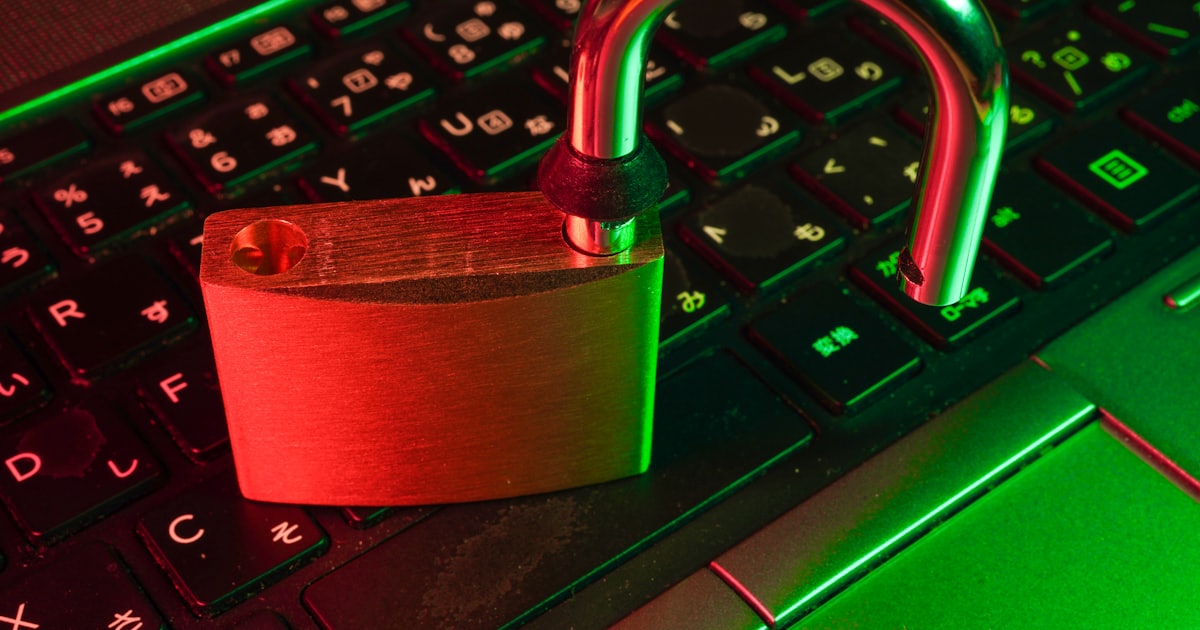 red padlock on black computer keyboard