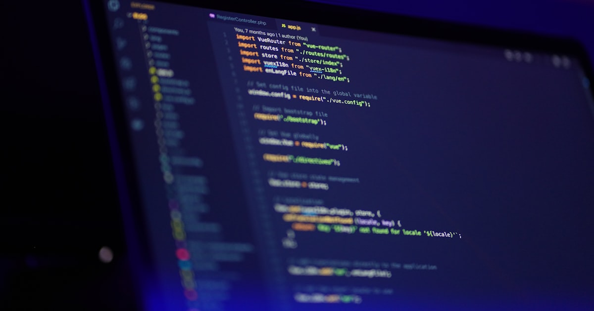 laptop screen displaying colorful code