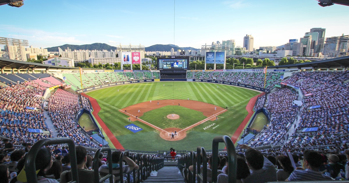 a baseball stadium filled with lots of people