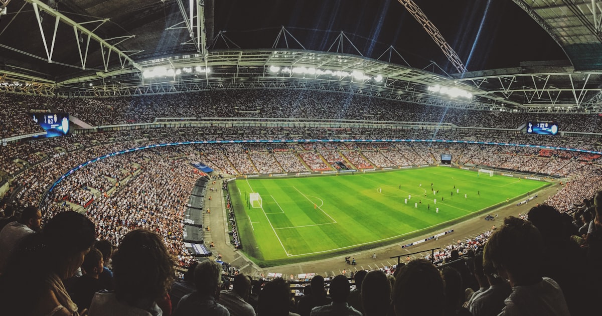 crowd watching football game inside stadium